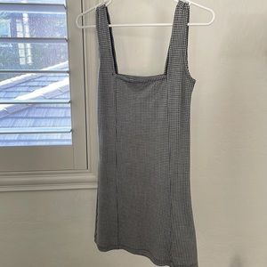 Stripped tight dress with broach buckle details